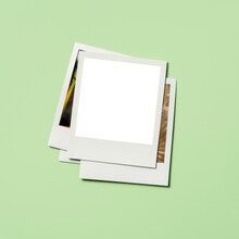 Stack Of Instant Pictures With Blank On Top