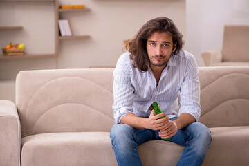 Poster - Young man drinking alcohol at home