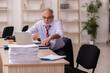 © Elnur - Old businessman employee sitting in the office