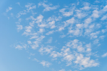 the sky is bright blue with beautiful fluffy clouds. blue sky with clouds