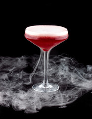 Smoke bubble strawberry cocktail on black background. After bubble burst. Isolated