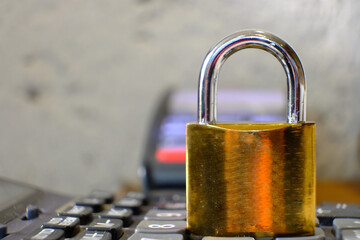 Poster - Padlock on table background and business security concept, protecting data personal information
