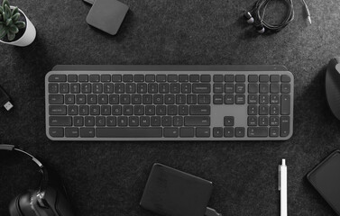Poster - top view of office desk table with keyboard, mouse, smartphone and accessory on table.