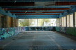 Abandoned swimming pool with blue tiles