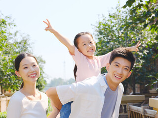 Happy family of three in the outdoor group photo