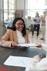 Poster - Smiling Afro-American woman giving her CV to HR manager