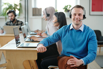 Poster - Friendly call center operator in headset