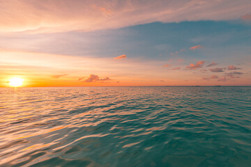 Relaxing seascape with wide horizon of the sky and the sea. Beautiful seascape panorama. Cloudy sky with relaxing reflection, calm ocean water. Sunlight, coast shore of island beach