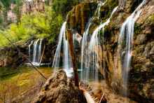 Water Flows Over A Cliff At Hanging Lake Colorado