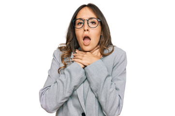 Canvas Print - Young brunette woman wearing business clothes shouting and suffocate because painful strangle. health problem. asphyxiate and suicide concept.