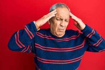 Canvas Print - Senior hispanic man wearing casual clothes with hand on head, headache because stress. suffering migraine.