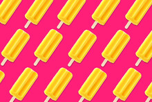 Colorful summer pattern. Bright yellow ice pops on a bold pink background. Top view.