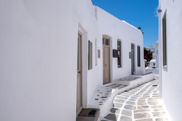 Wall Mural - Mykonos, Greece. Traditional whitewashed buildings and narrow streets,