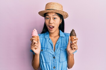 Sticker - Young chinese woman wearing summer style holding ice cream celebrating crazy and amazed for success with open eyes screaming excited.