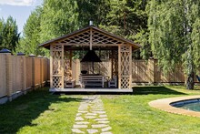 Wooden Barbecue Gazebo, Patio Area And Swimming Pool In Backyard Of Country House. Ideal Place For A Country Vacation.