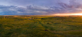 Fototapeta  - Dramatic sunset over the prairie Badlands National Park - South Dakota
