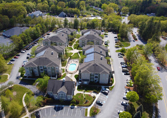 Wall Mural - aerial view of apartment buildings with solar panel installed on roof 