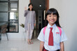 © Odua Images - Back to school. smiling asian pupil girl with backpack going to school. indonesian student uniform