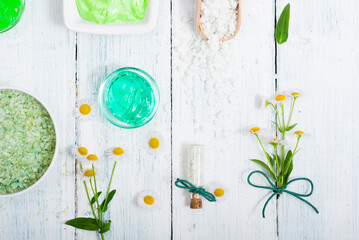 Wall Mural - beauty product samples with chamomile flowers on white wooden table