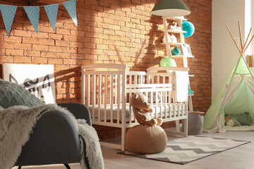 Interior of modern children's room with comfortable baby bed