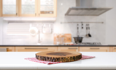 Wood table top on blurred kitchen background.