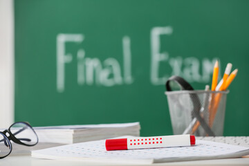 Wall Mural - Answer sheet forms with marker on table in classroom