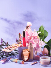 Canvas Print - Make up products group with brushes on purple scene background with cube podium