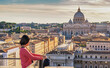 © Noppasinw - Rome Vatican Italy high angle view sunset city skyline with woman tourist