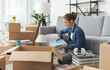 © StockPhotoPro - Young woman moving in her new apartment