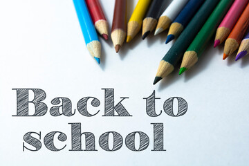 Wall Mural - Text Back to school on color pencil background