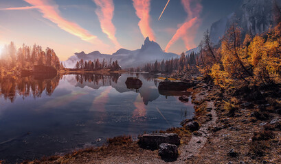 Fotobehang - Wonderful evening view on autumn Mountains landscape. Amazing nature scenery of Dolomites mountains during sunset. Colorful sunset. Picture of wild nature, Natural backgraund