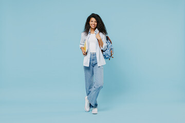 full length young happy african american girl teen student wear denim clothes backpack hold books is