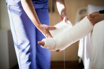 Wall Mural - Young Caucasian girl with broken leg in plaster cast