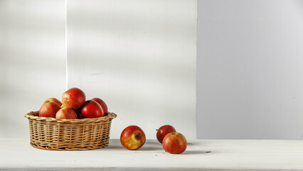 Wall Mural - Fresh red apples and wall with shadows 