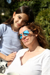 Wall Mural - mother and daughter relaxed outdoors in the sun