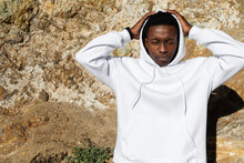 African American Man In White Hoodie Posing Outdoor Photoshoot