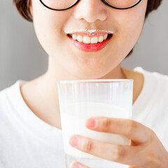 Wall Mural - A woman drinking milk