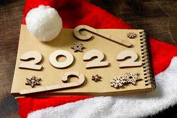 Happy New Year. The number 2022 is written in a notebook