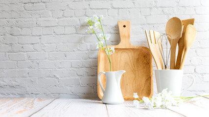 Wall Mural - Kitchen tools and kitchenware utensil object on kitchen shelf wood white for healthy eat and health care life.  Wall white brick background, copy space for text