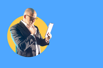 Poster - focused businessman with tablet. investor looks into tablet computer. concept - investing through an