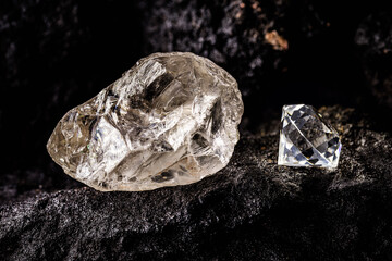 Poster - cut diamond with rough diamond gem on kimberlite rock, on isolated background, diamond business concept.