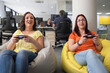 © Branislava Živić/Stocksy - Female colleague playing video games in it office and having fun