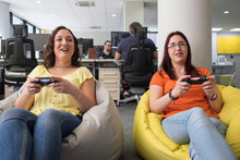 Female Colleague Playing Video Games In It Office And Having Fun 