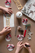 © Beatrix Boros/Stocksy - Two kids creating Christmas DIY projects