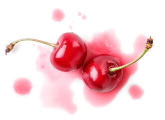 Wall Mural - Two ripe cherries crushed on a white background. Top view.