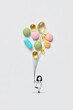 © Yaroslav Danylchenko/Stocksy - Girl holding pills in shape of balloons