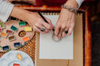 © Eloisa Ramos/Stocksy - Close-up of senior woman painting mandalas with a special ruler