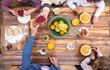 © VICTOR TORRES/Stocksy - Family enjoying healthy breakfast together