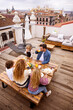 © VICTOR TORRES/Stocksy - Family eating breakfast on terrace