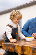 © VICTOR TORRES/Stocksy - Happy kid having healthy meal for breakfast